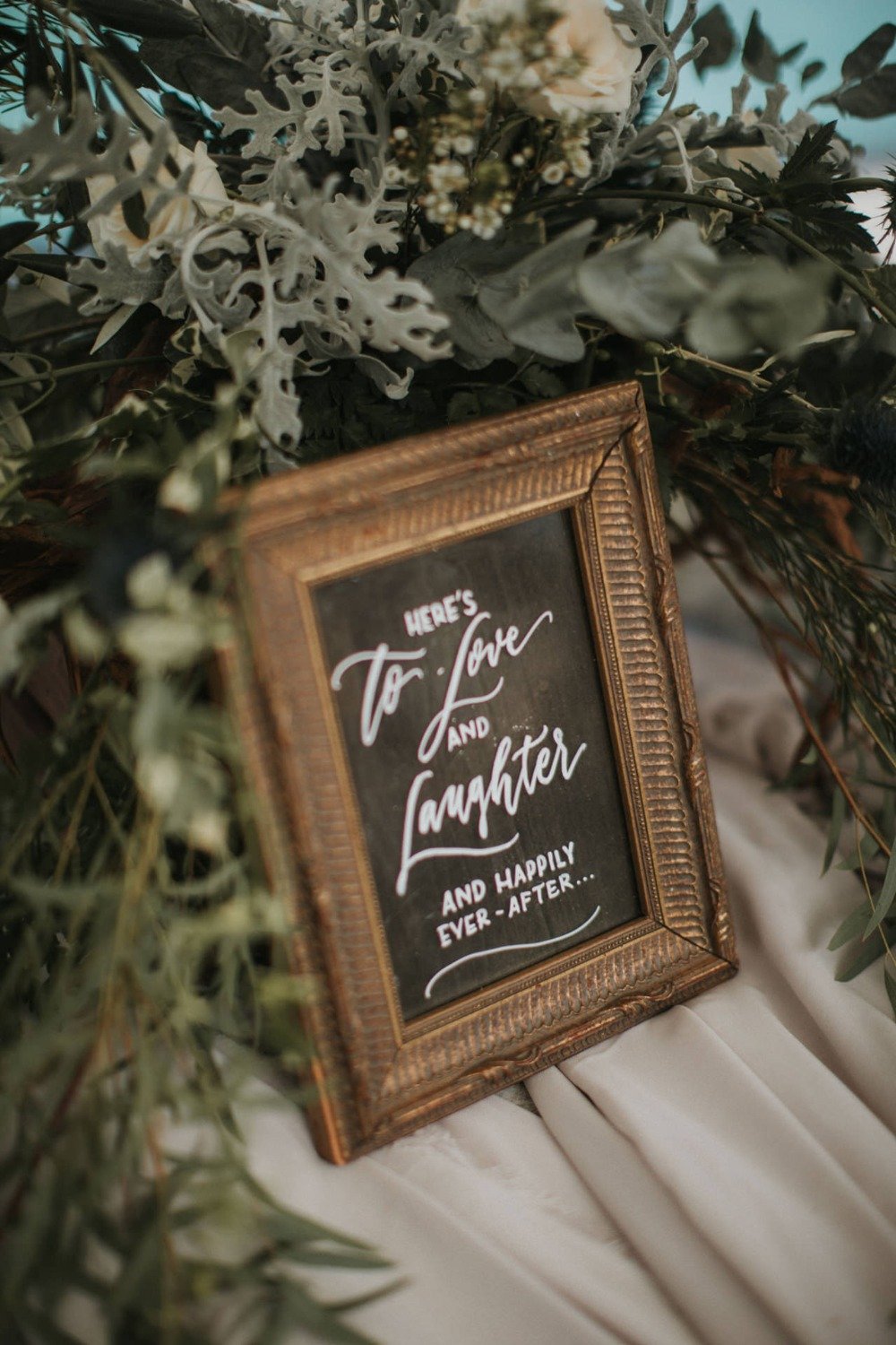 to love and laughter wedding sign