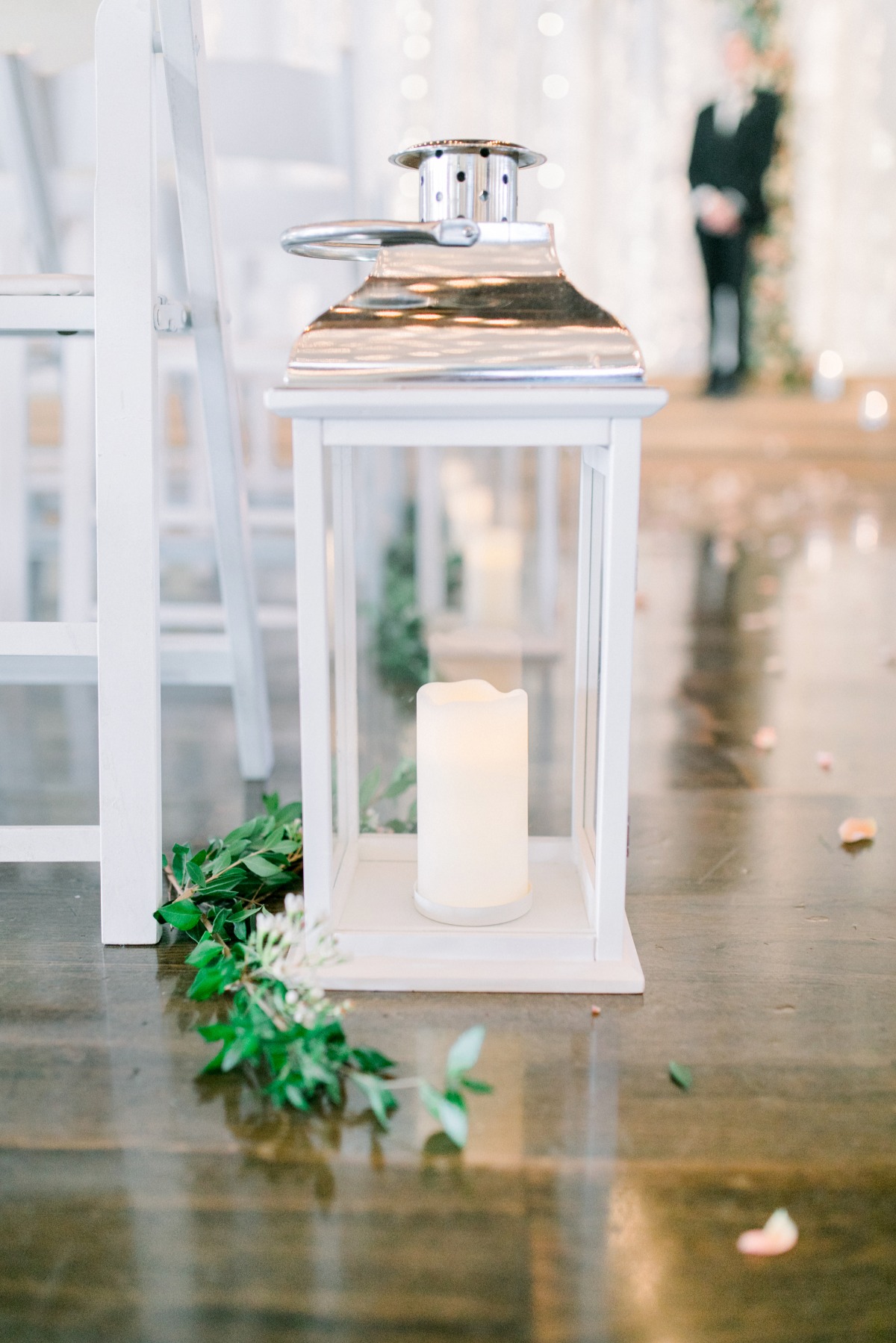 White lantern with candle and leaves wedding decoration