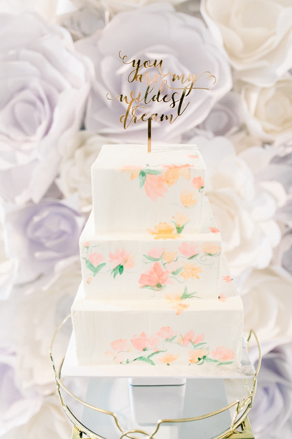 Floral wedding cake with wildest dream cake topper
