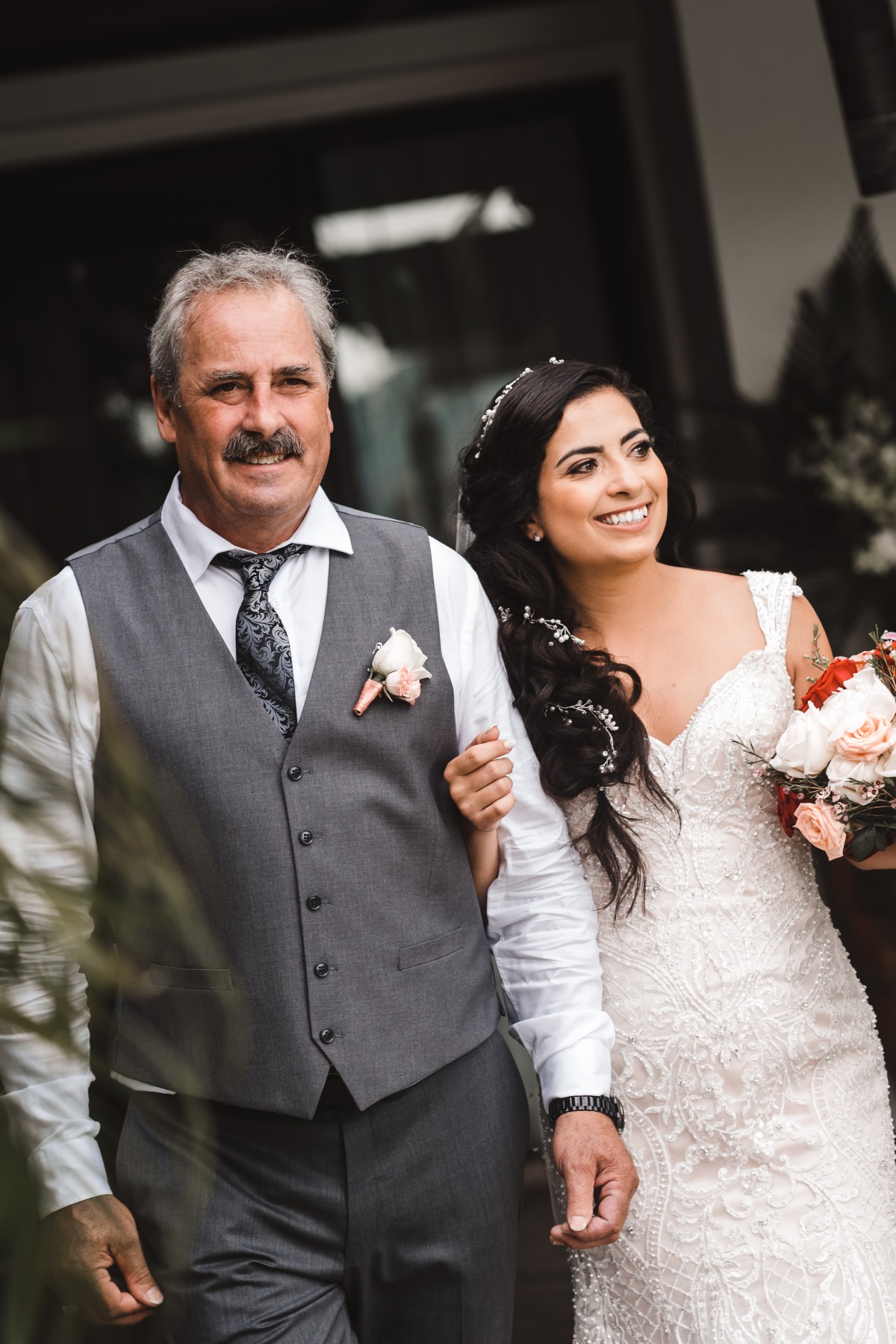 Bride walks with father on her wedding day ceremony