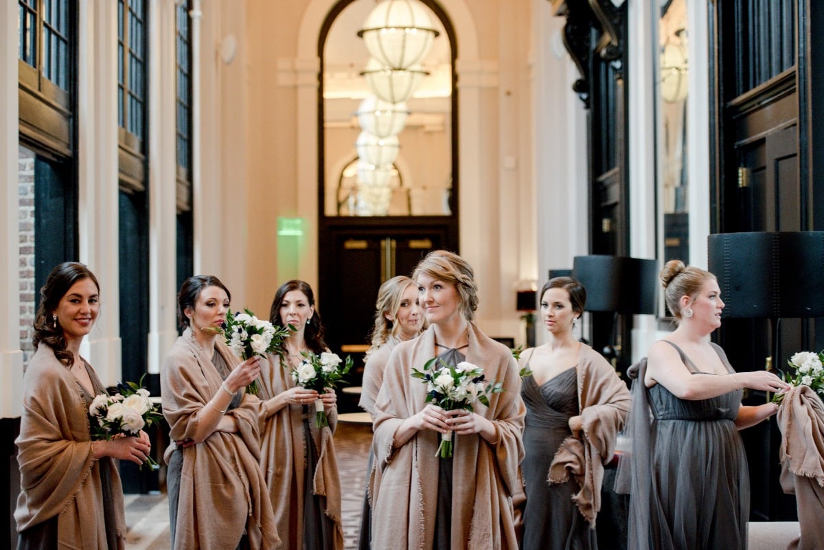 bridesmaids in grey dresses and camel colored shalls