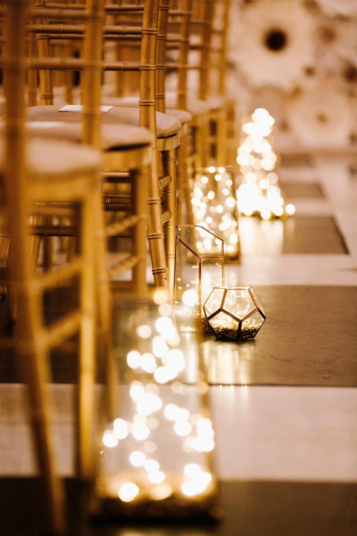 fairy light lit lantern wedding aisle