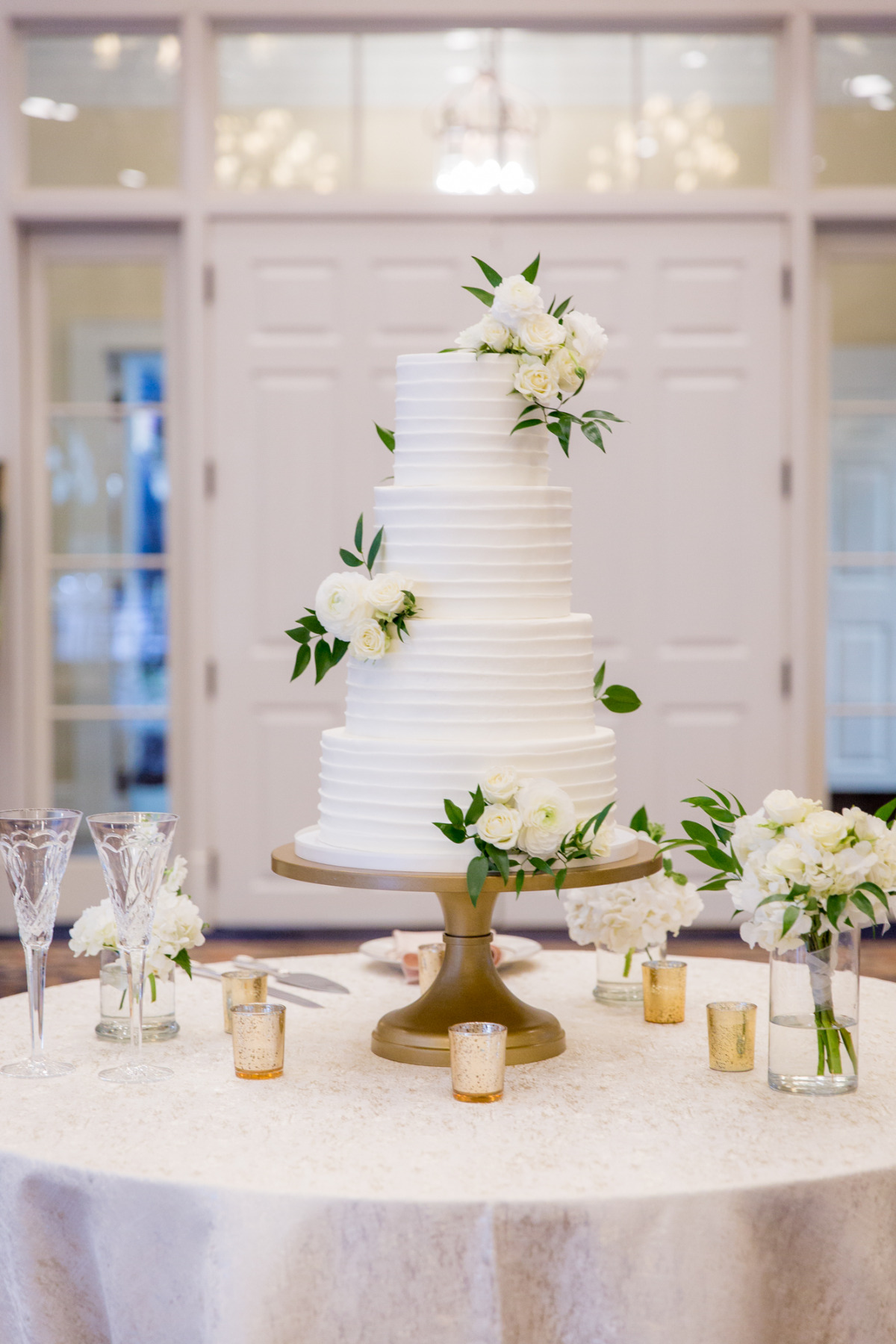 Elegant white wedding cake with floral decorations