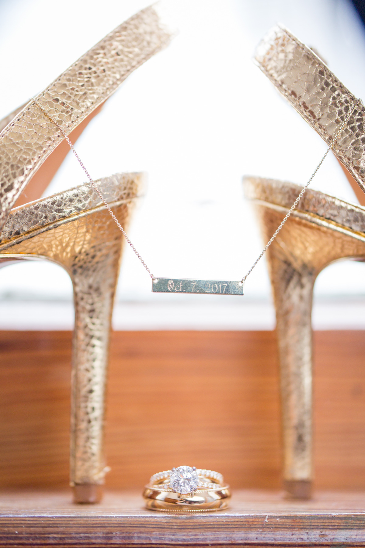 Golden wedding shoes rings and personalized necklace