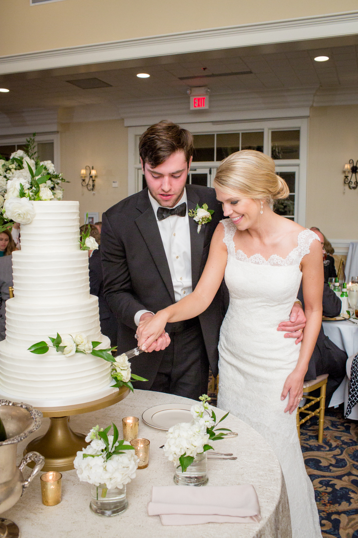 Bride and groom cutting their elegant wedding cake