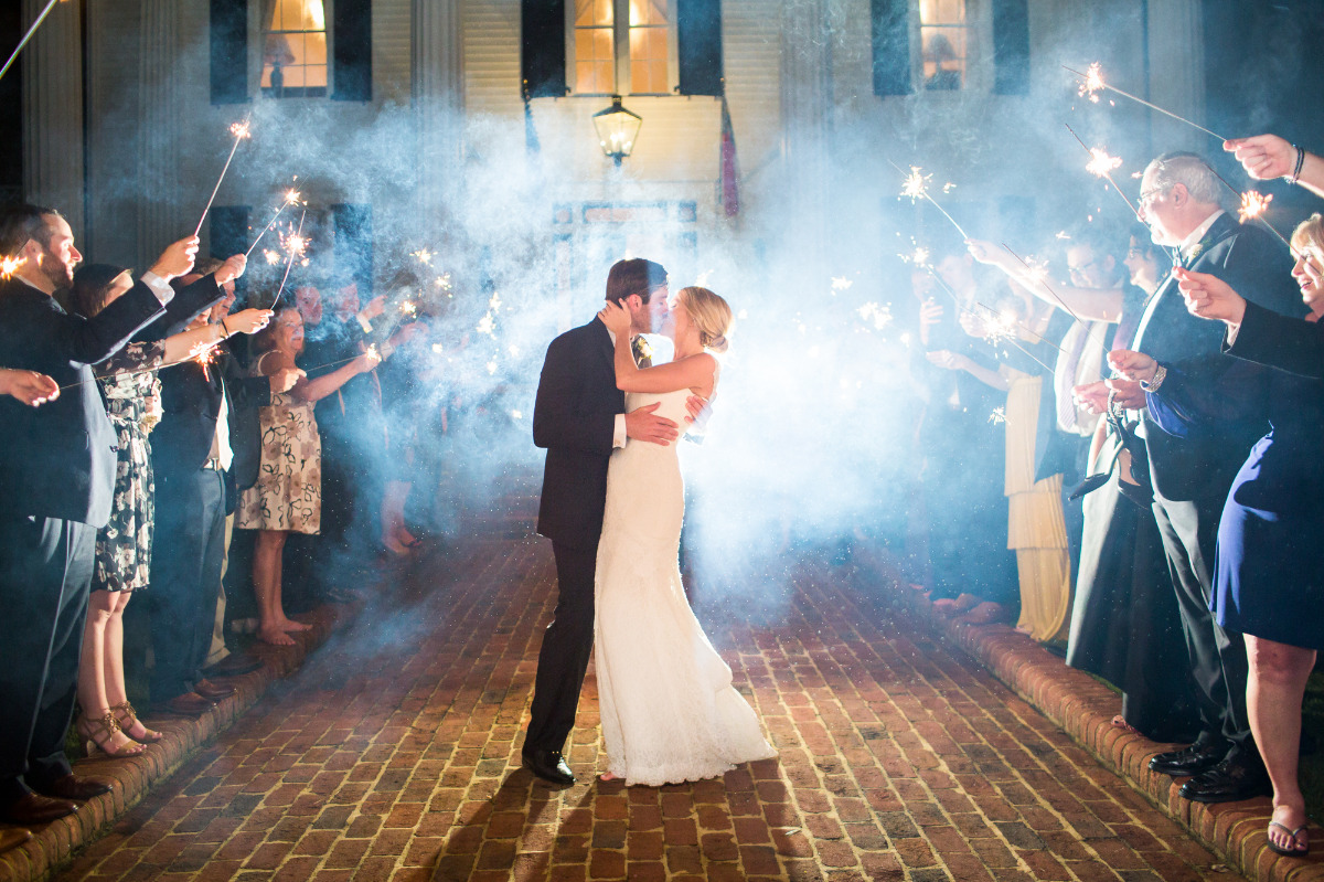 Newlyweds share sparkler send off kiss at their wedding