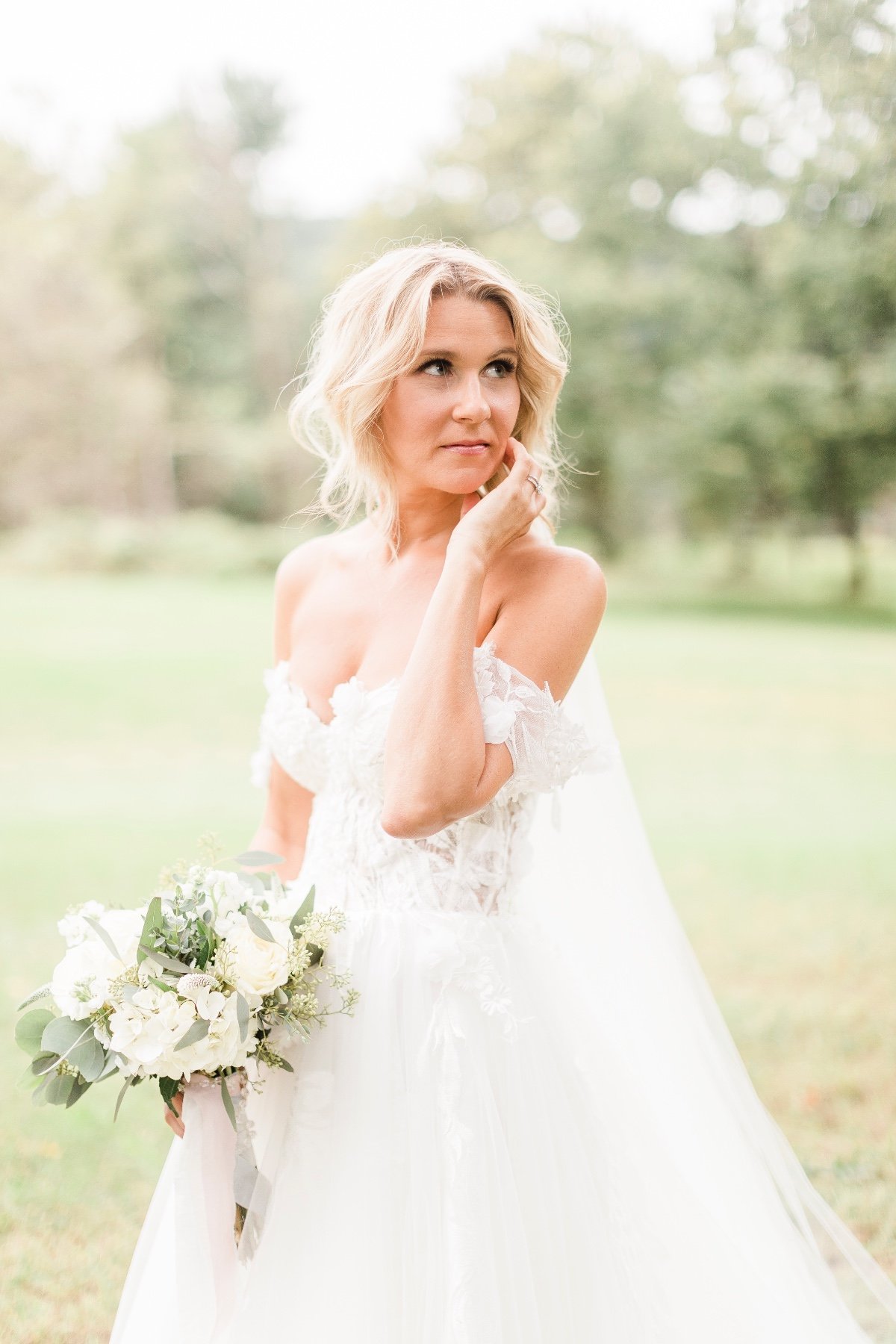 beautiful bride with off the shoulder dress