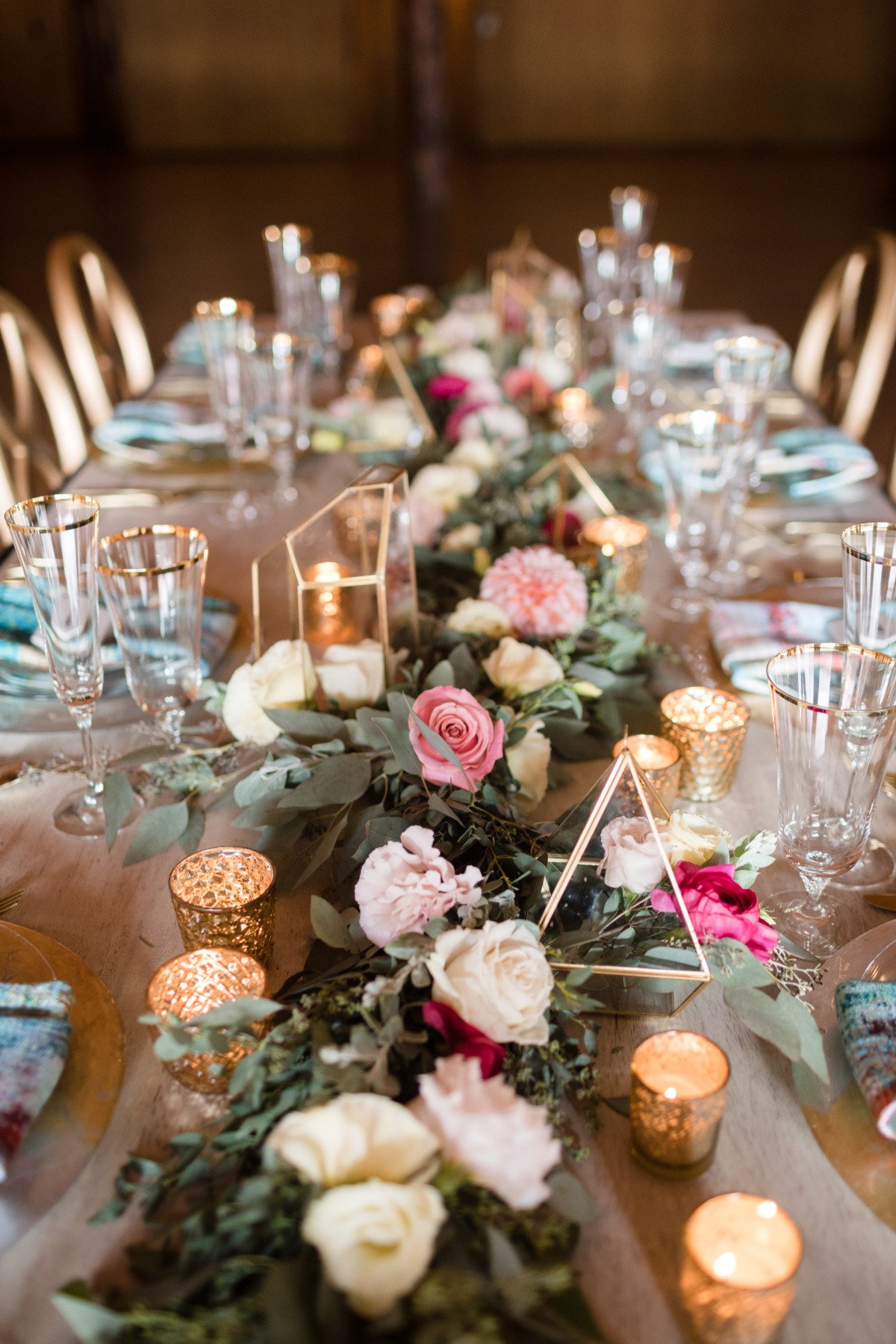 fun and funky wedding table with floral garland