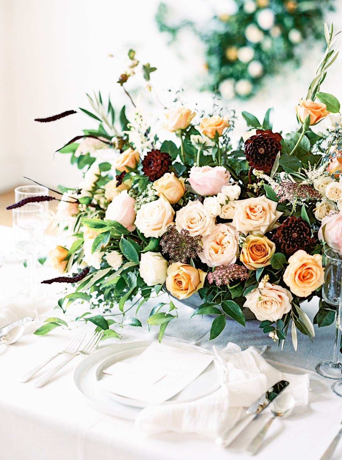 ivory yellow blush and burgundy floral centerpiece