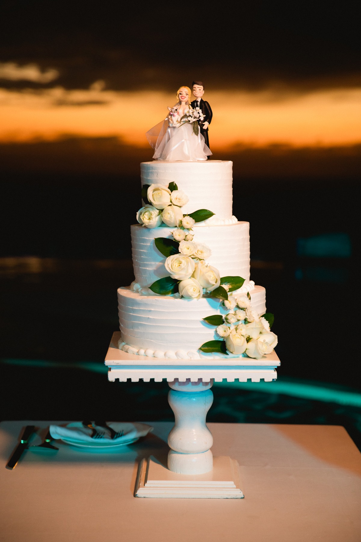 White wedding cake with roses