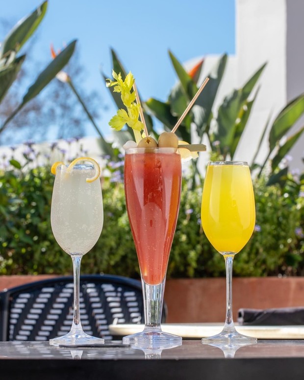 Assorted cocktails brunch drinks outdoors sunny day