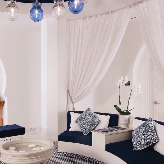 Elegant spa waiting area with white and blue decor