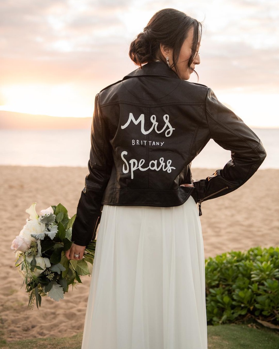 Bride in black leather jacket, Mrs Brittany Spears on back