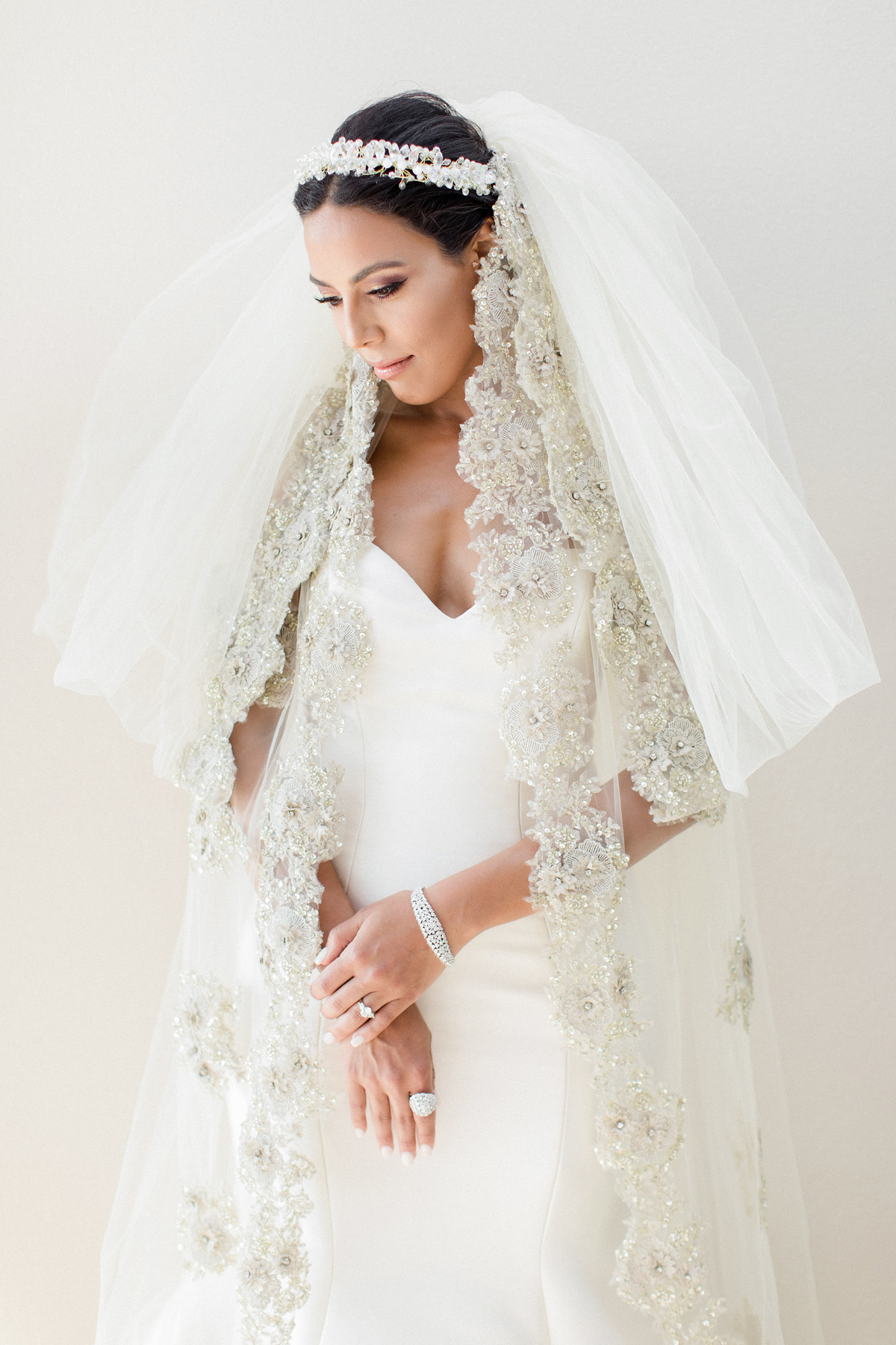 Monique Lhuillier wedding dress and dramatic wedding veil