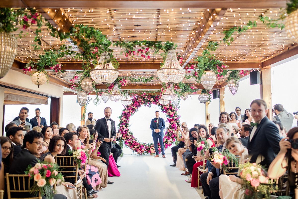 dramatic pink floral and fairy light wedding decor