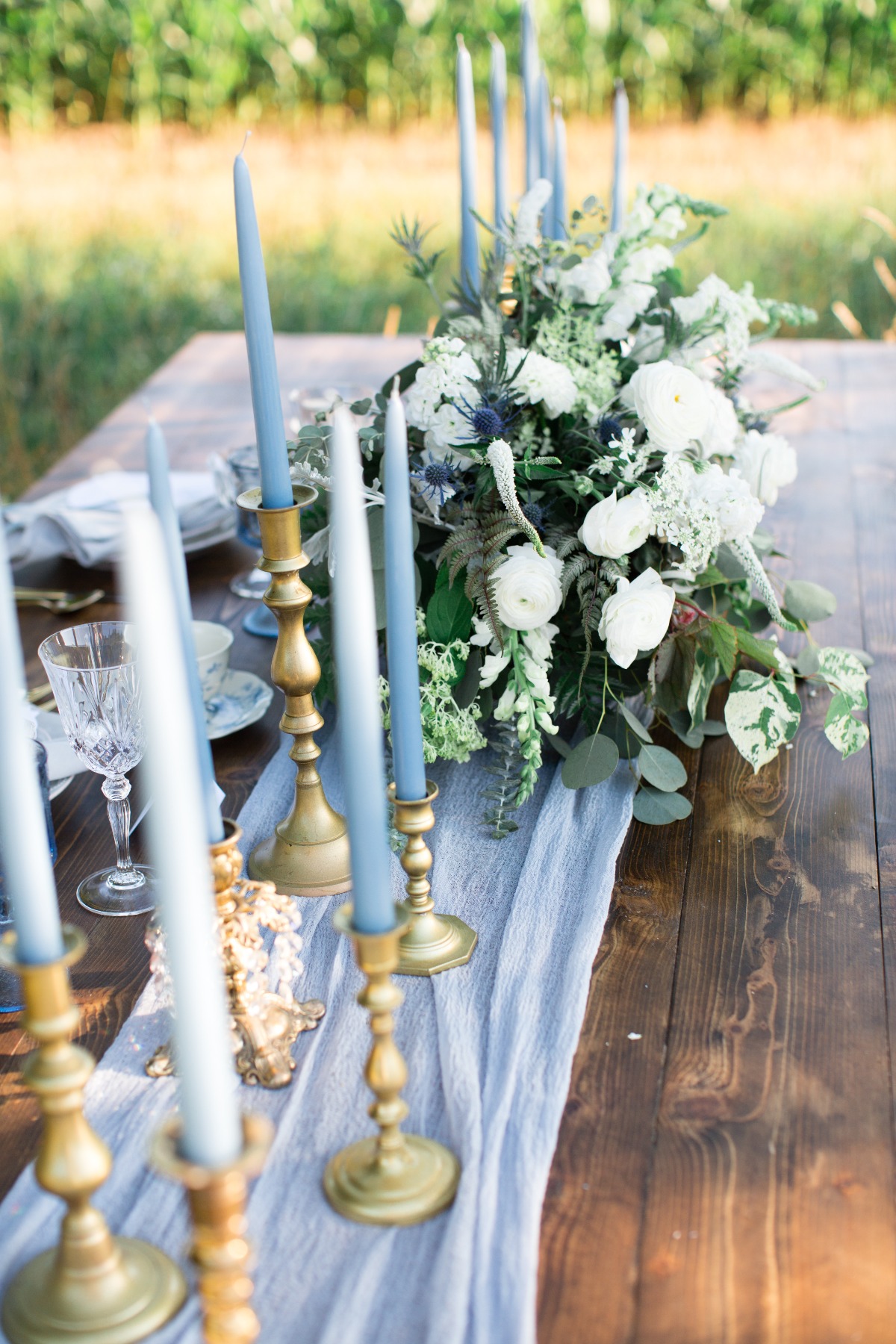 Elegant table setting with candles and floral centerpiece for an event