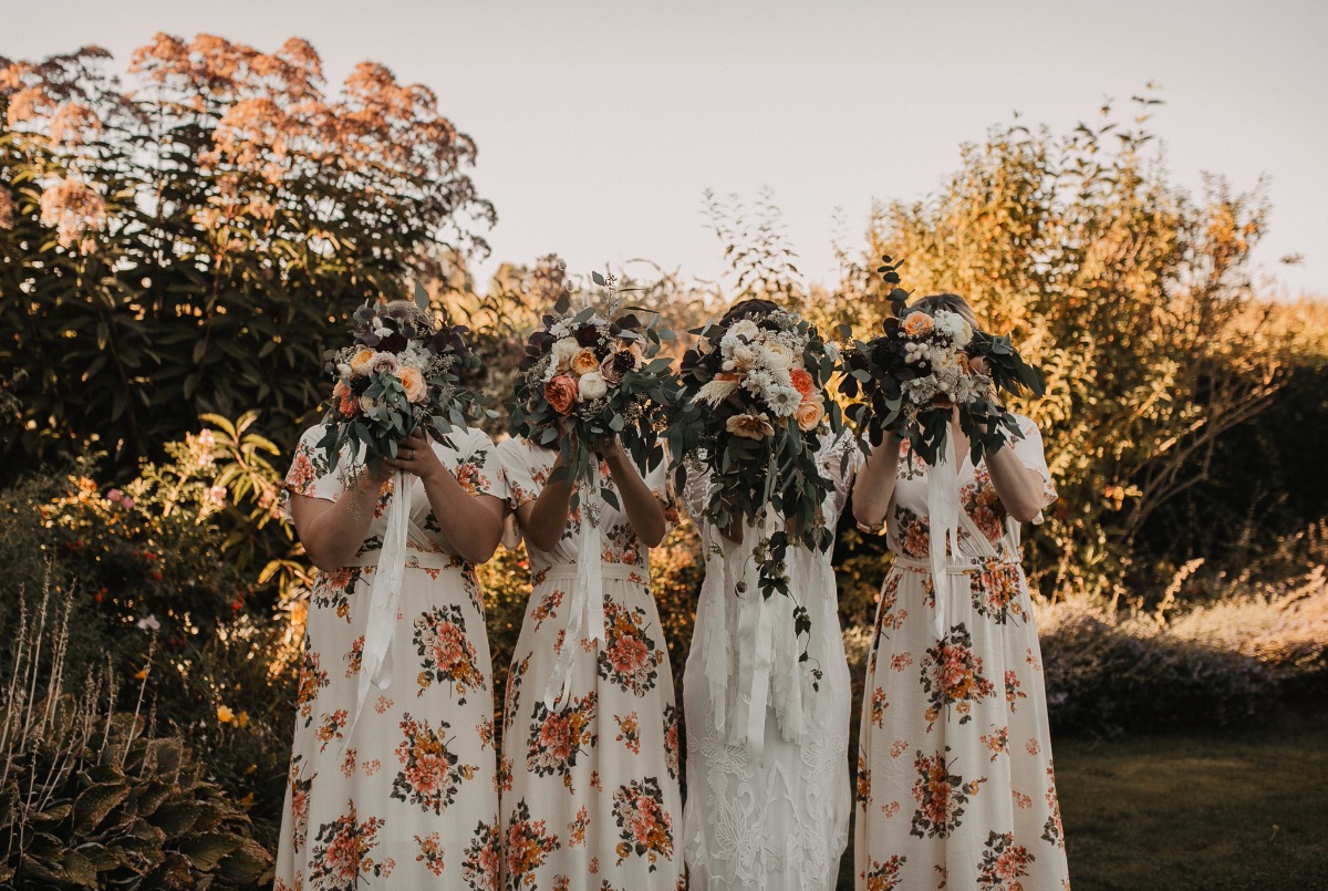 bridesmaids in fun floral dresses