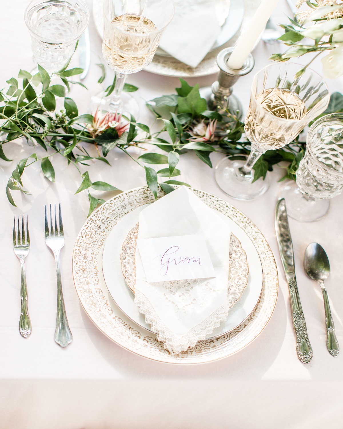 white and gold accented wedding place setting