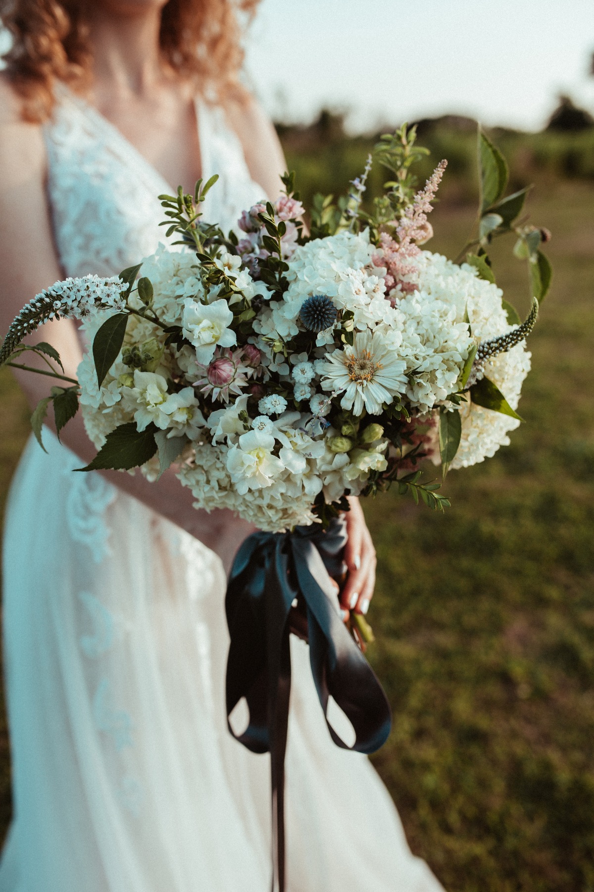 Elegant wedding bouquet with black ribbon