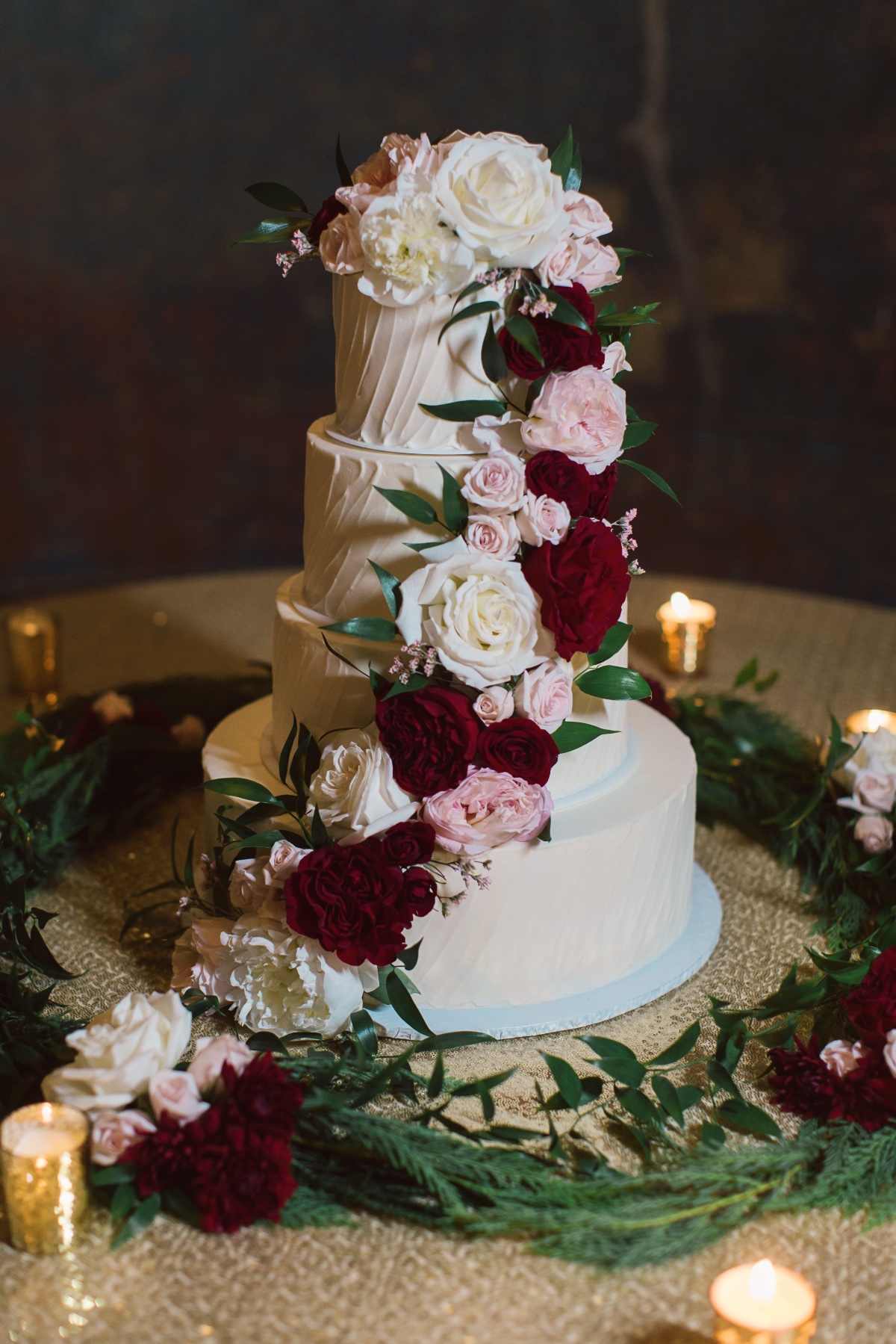 4 tier wedding cake with roses