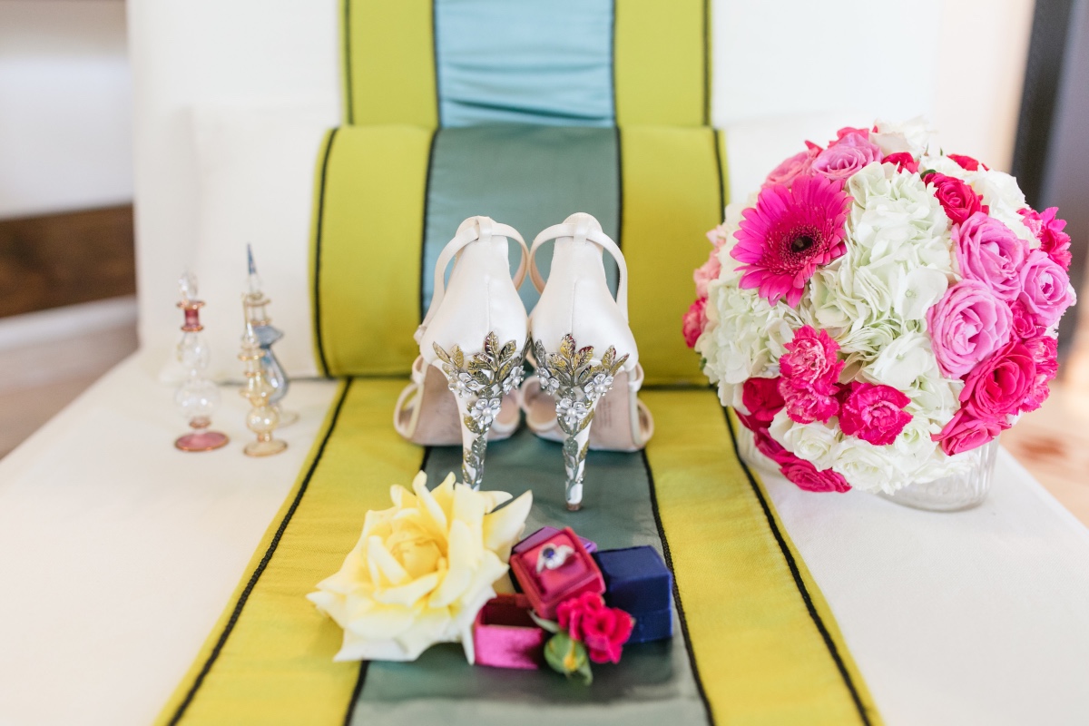 Wedding details: bridal shoes, bouquet, and engagement ring