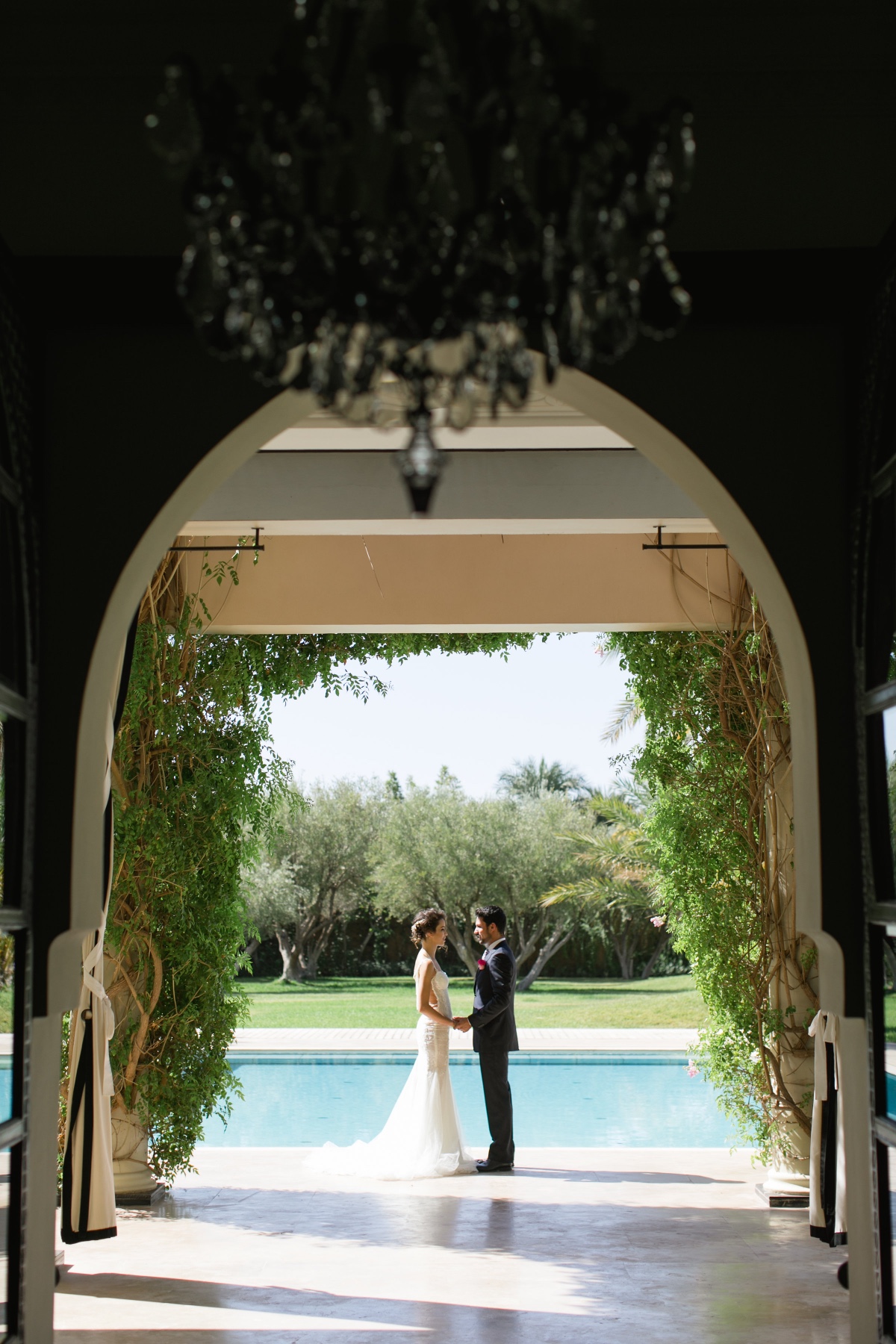 Elegant wedding by a pool at a tropical resort location