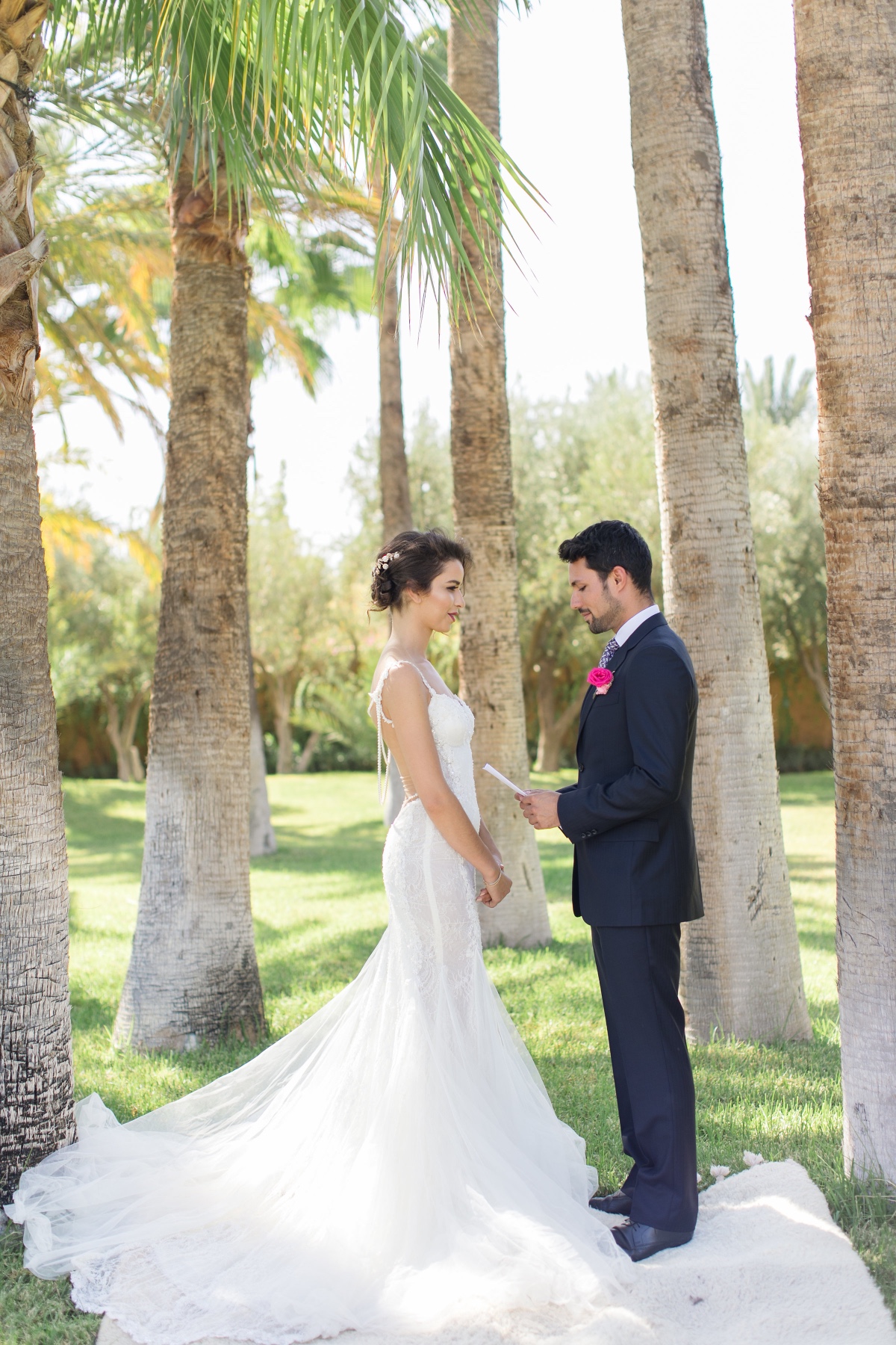 Bride and groom exchanging vows at outdoor wedding ceremony