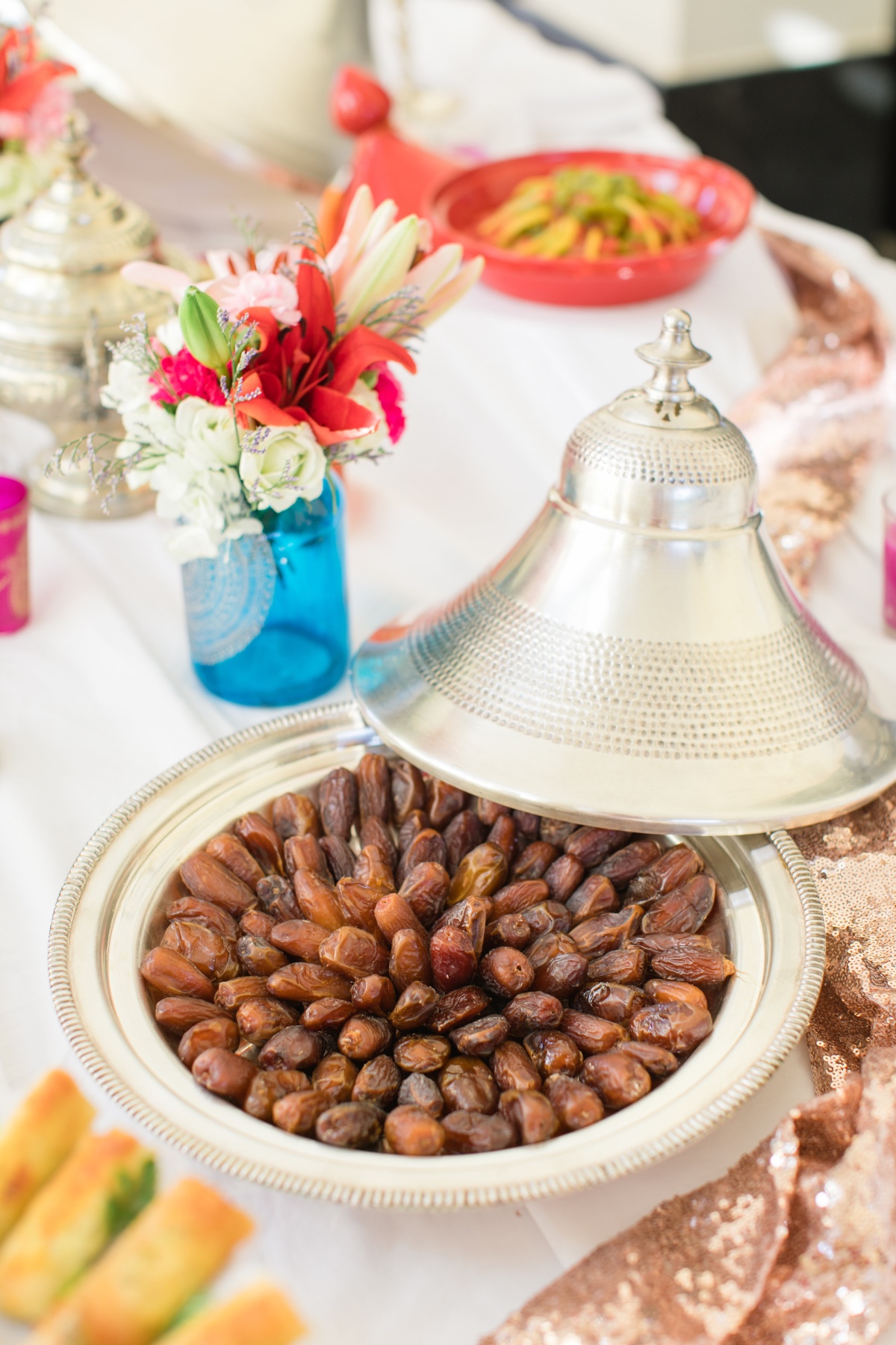 Dates in a silver tagine dish at a celebratory table