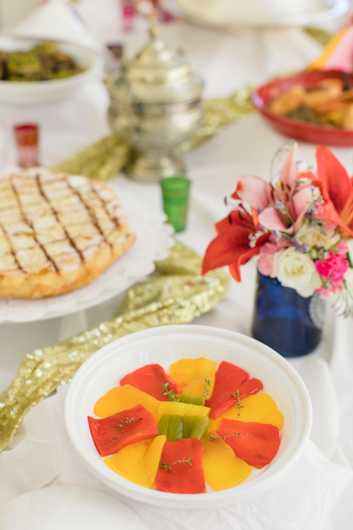 Festive table setting with colorful appetizers and flowers