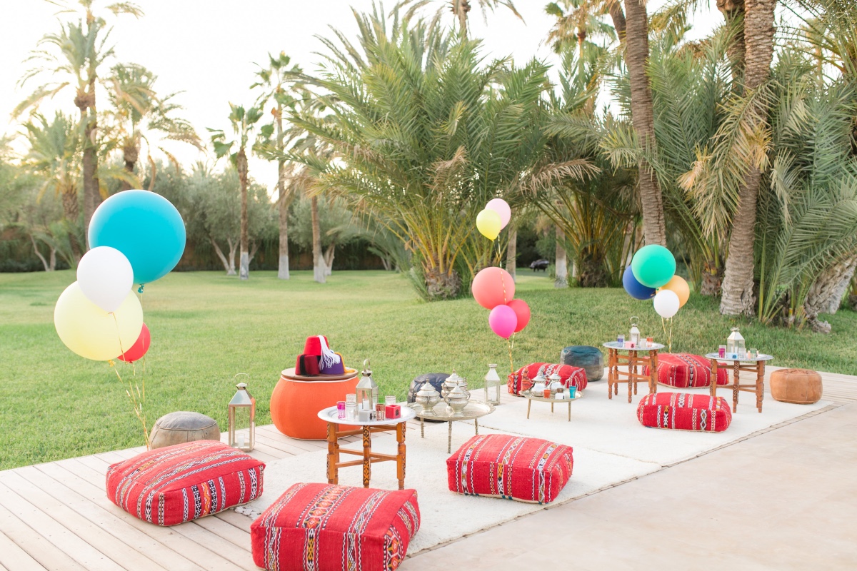 Moroccan garden party with colorful balloons and cushions