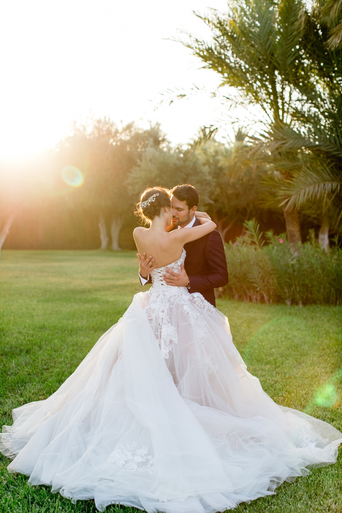 Romantic wedding portrait of bride and groom at sunset