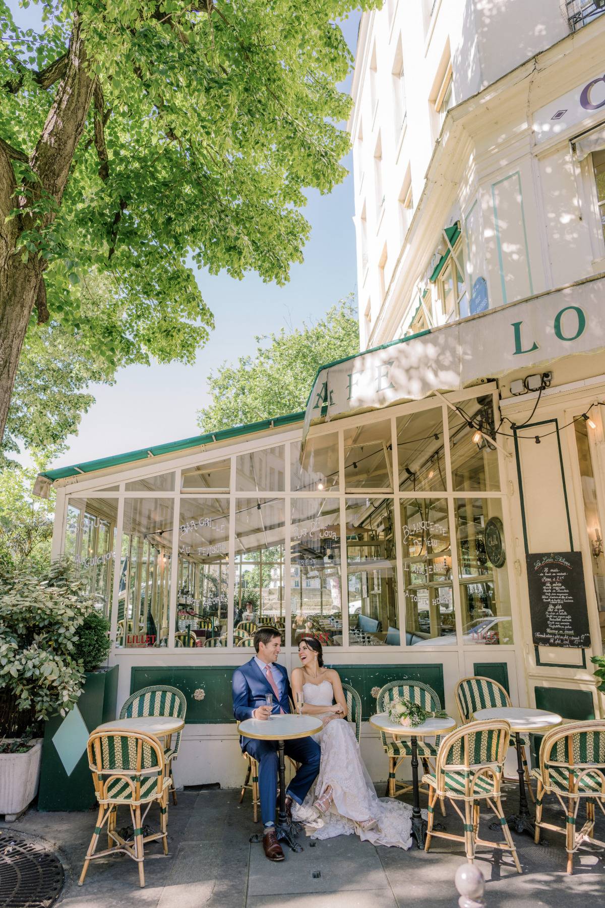 Parisian couple enjoying cafe au lait outdoors