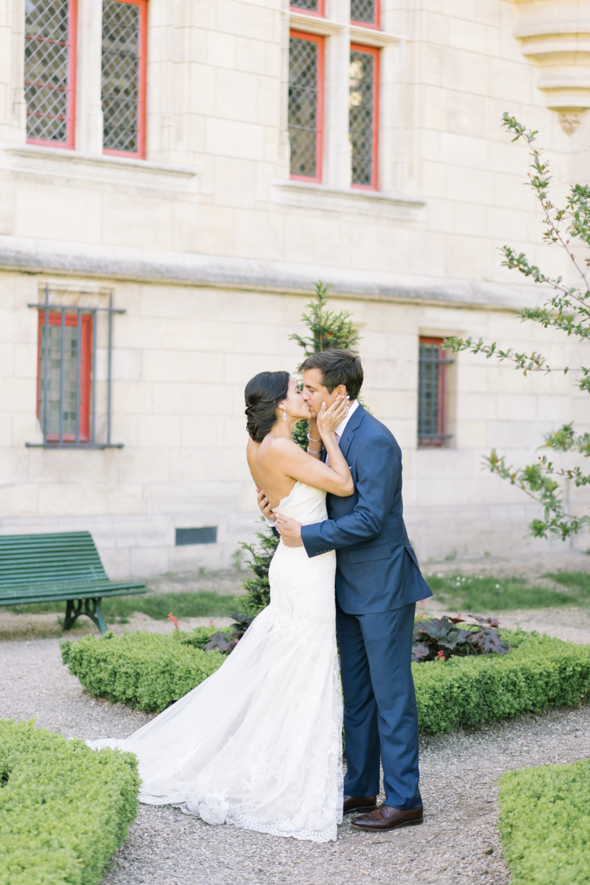Bride and groom share a romantic kiss at their wedding