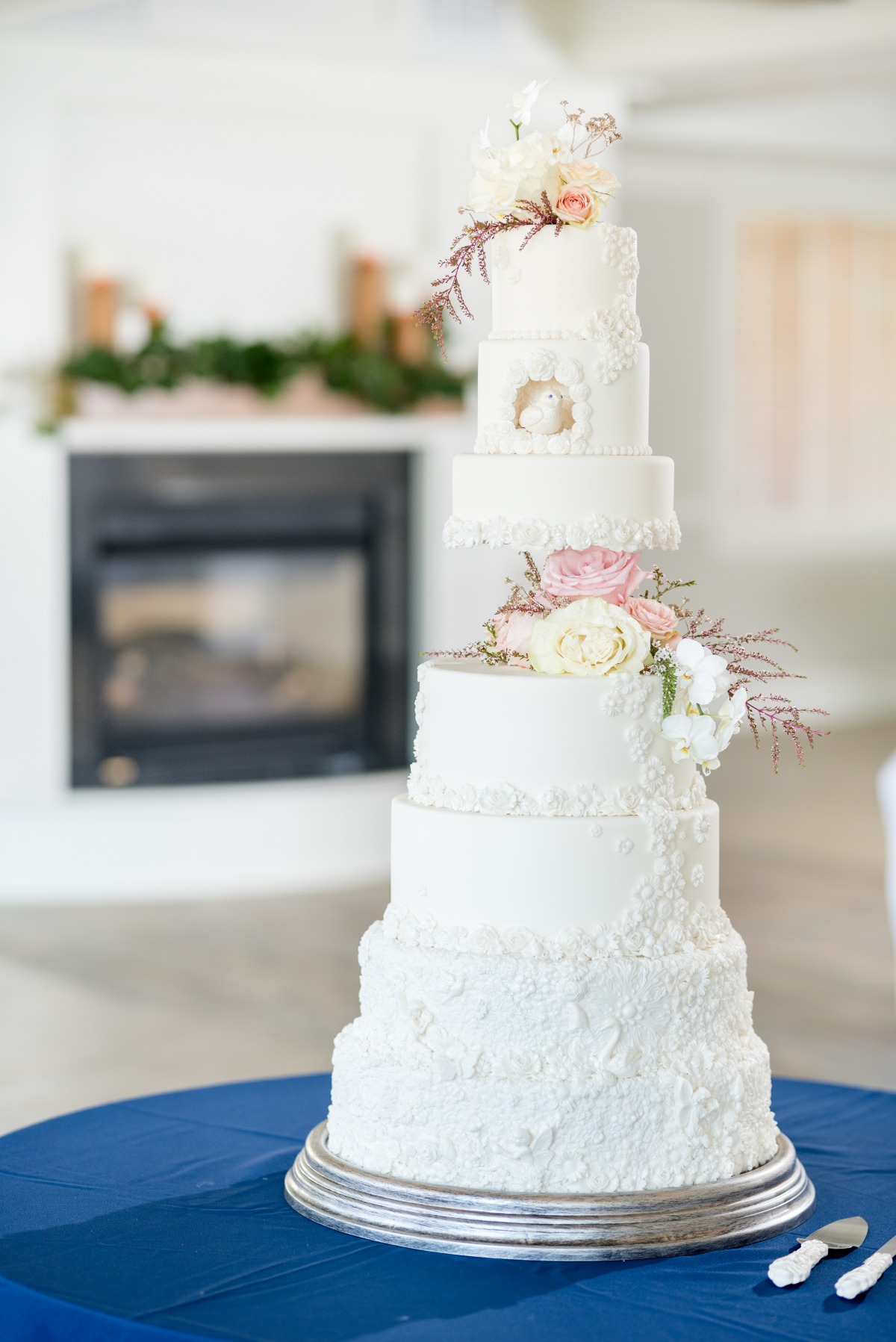 all white wedding cake with flower accents