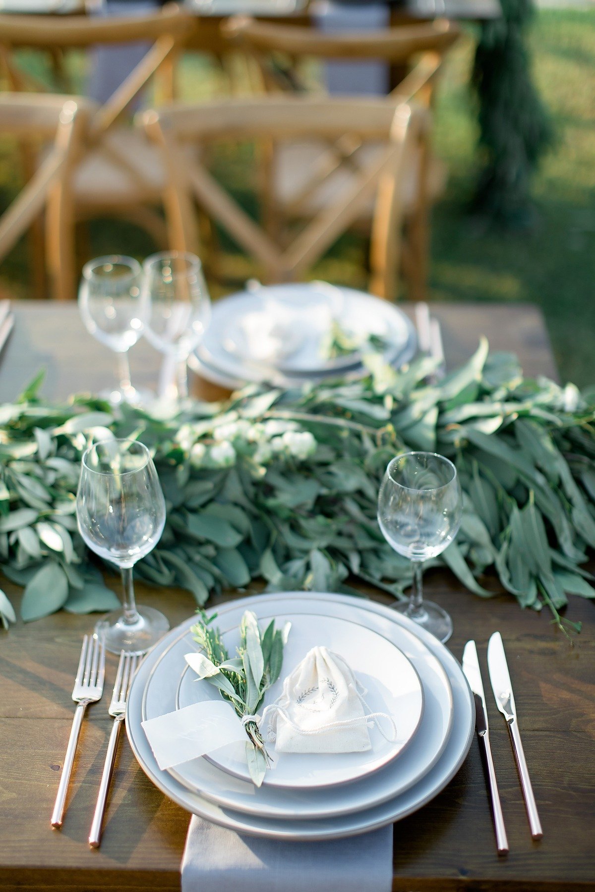 Wedding place setting with greenery