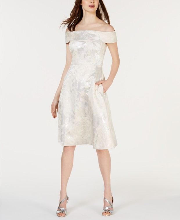 Woman in off-the-shoulder floral white party dress