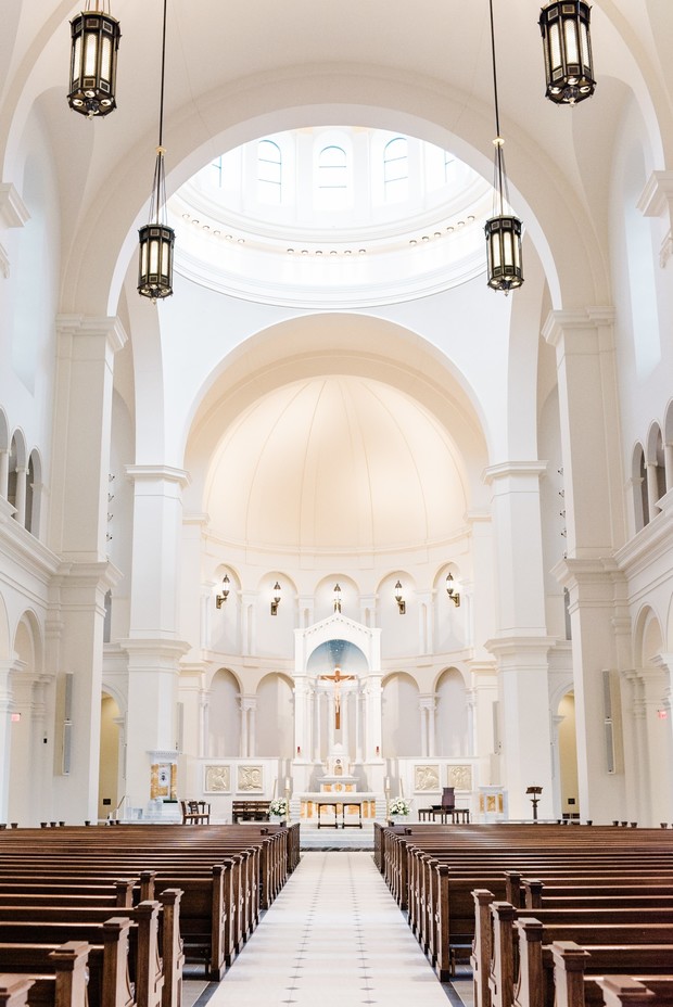 Beautiful white church interior with pews and altar