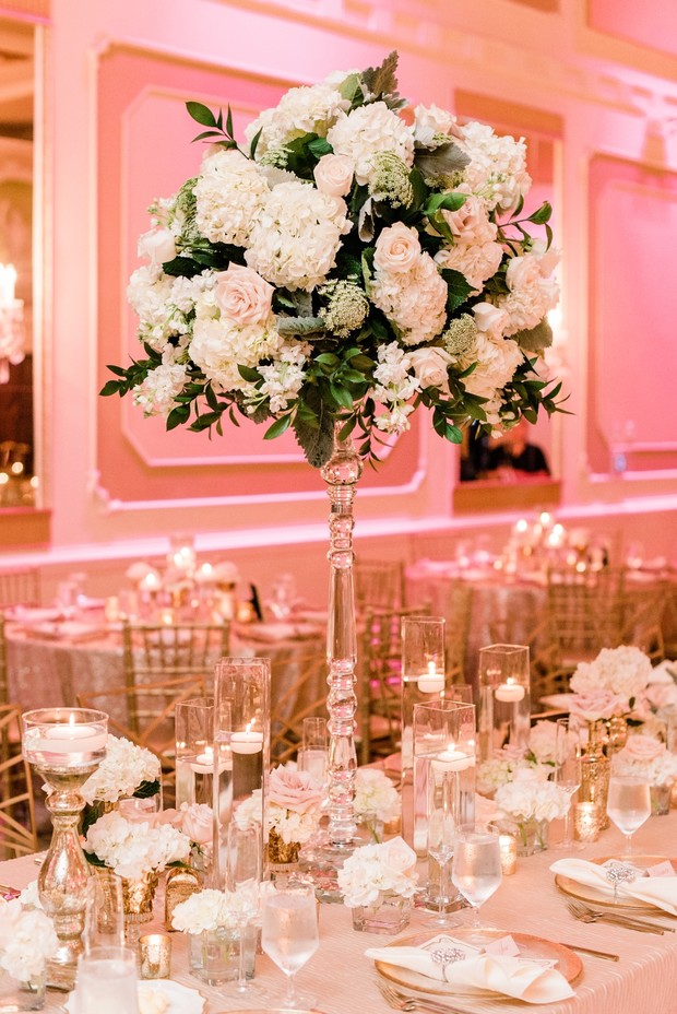 Elegant wedding reception table setting with floral centerpiece