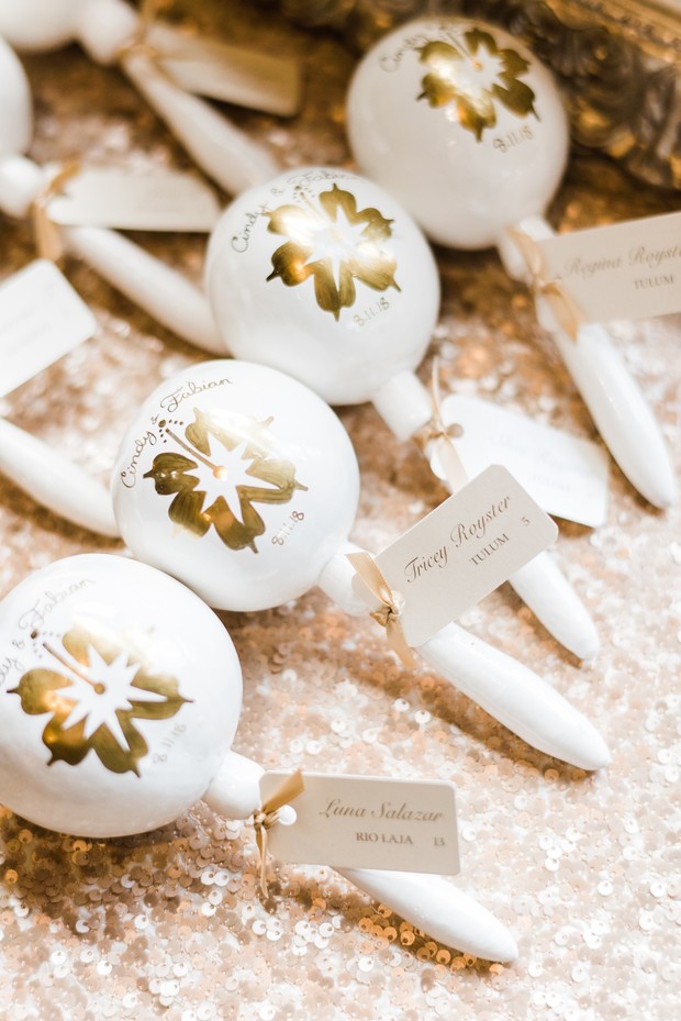 Wedding maracas with guest name tags on gold sequins