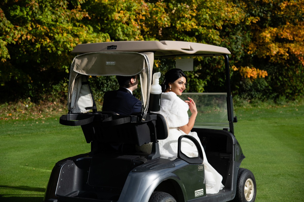 82-newlyweds-driving-away-in-a-golf-cart