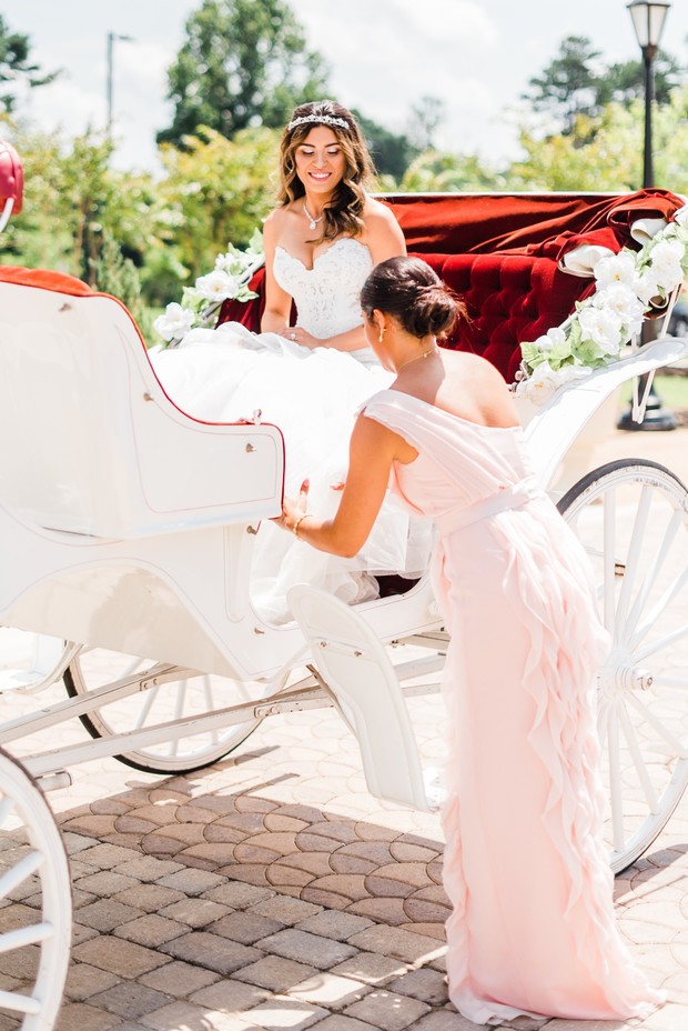 Bride arrives in style with a horse-drawn carriage wedding