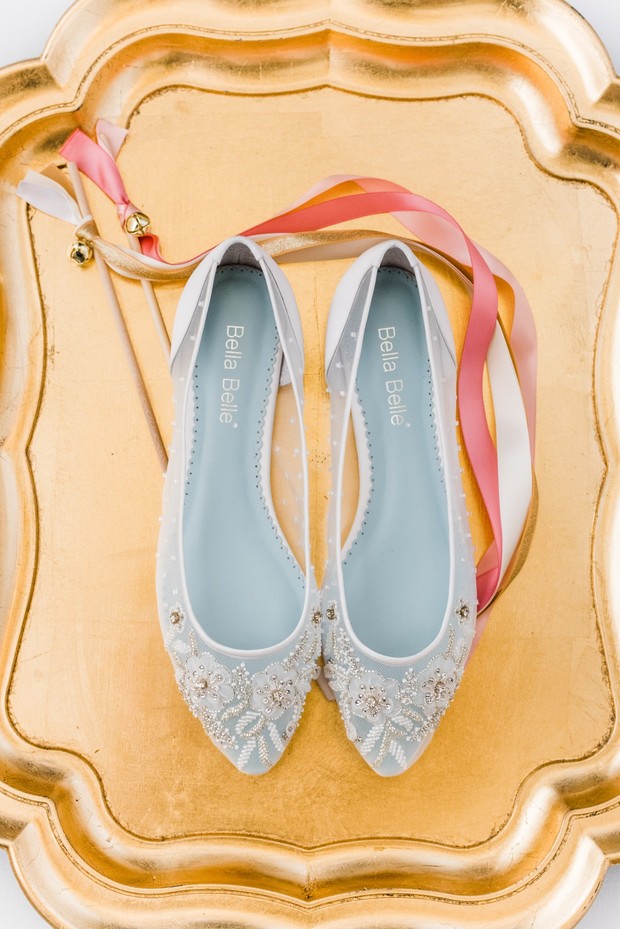 Bella Belle bridal flats embellished with beads on gold tray