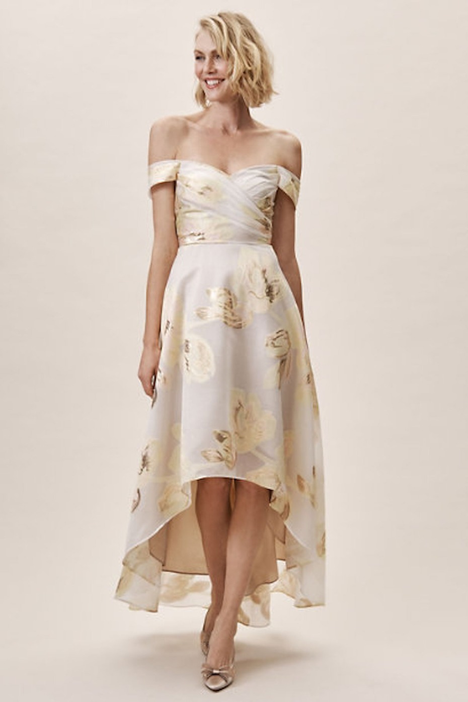 Woman wearing off-shoulder floral print high-low dress