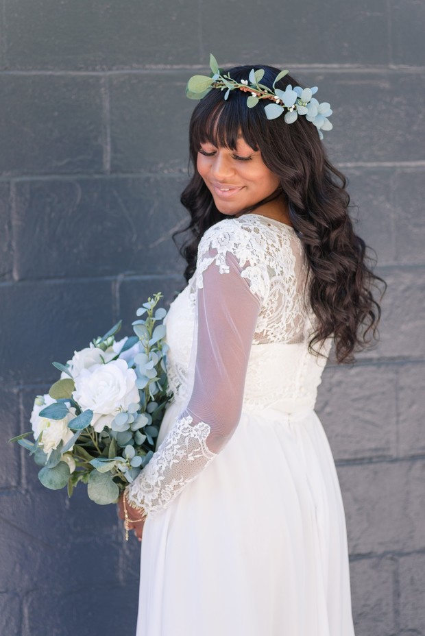 bride in sheer sleeve wedding dress