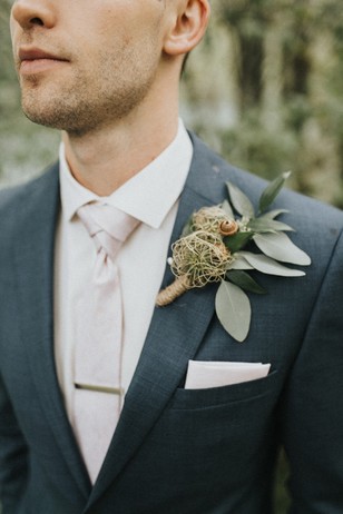 moss filled wedding boutonniere