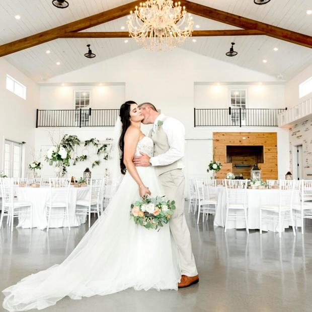 A loving couple sharing a sweet moment at their wedding reception