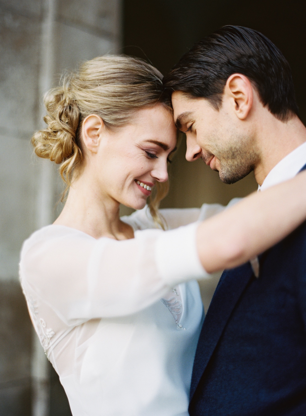Romantic wedding portrait of a loving couple embracing