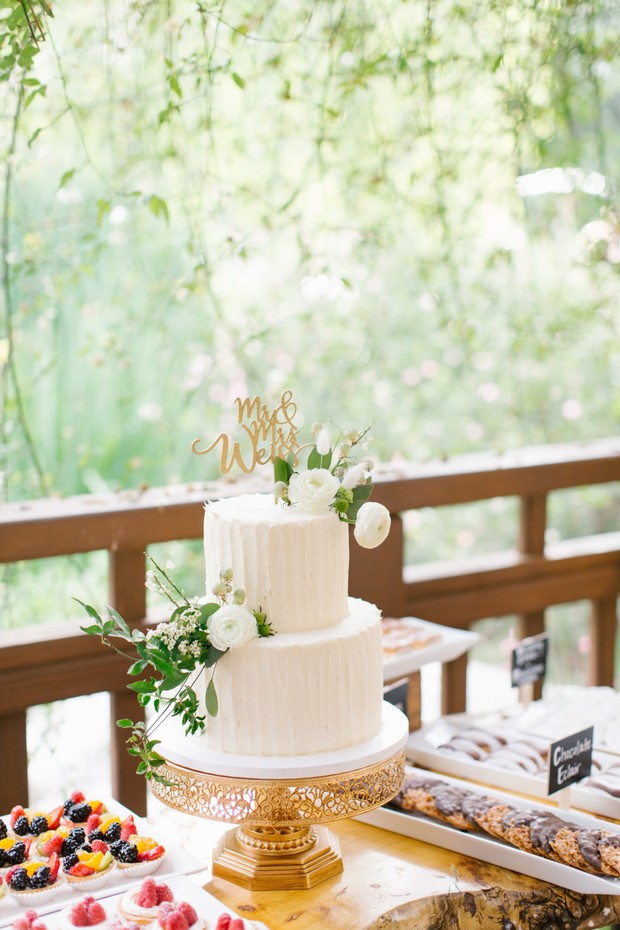 white flower topped wedding cake