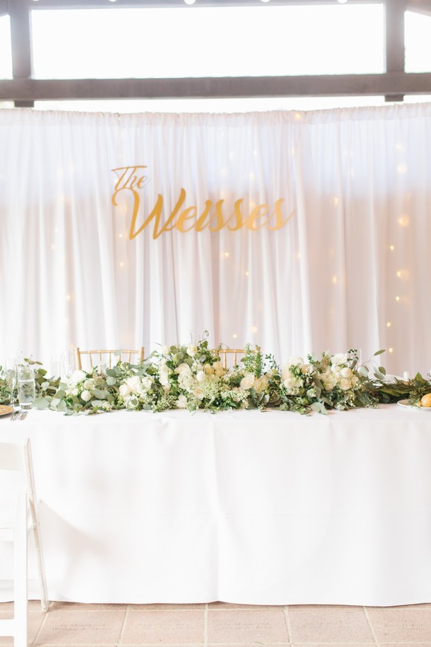 sweetheart table in white and gold