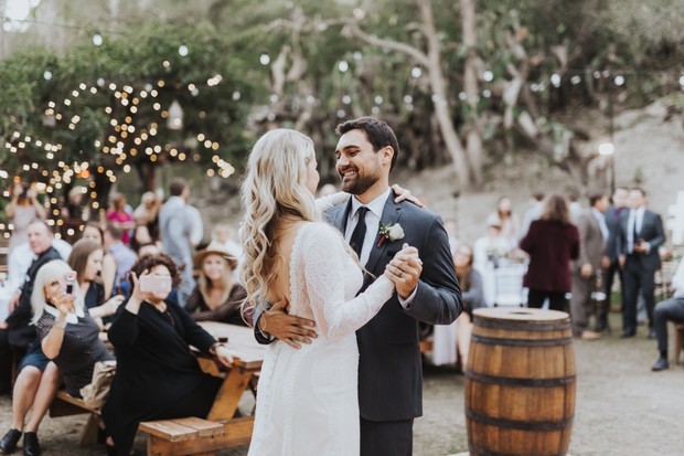 Bride and groom sharing a dance at their outdoor wedding reception